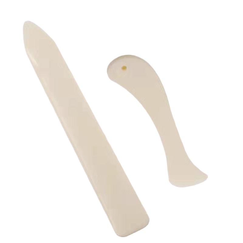 قطعتان من أدوات العمل بالجلد،  - مراجعة Bone Folder Tool وسعره
